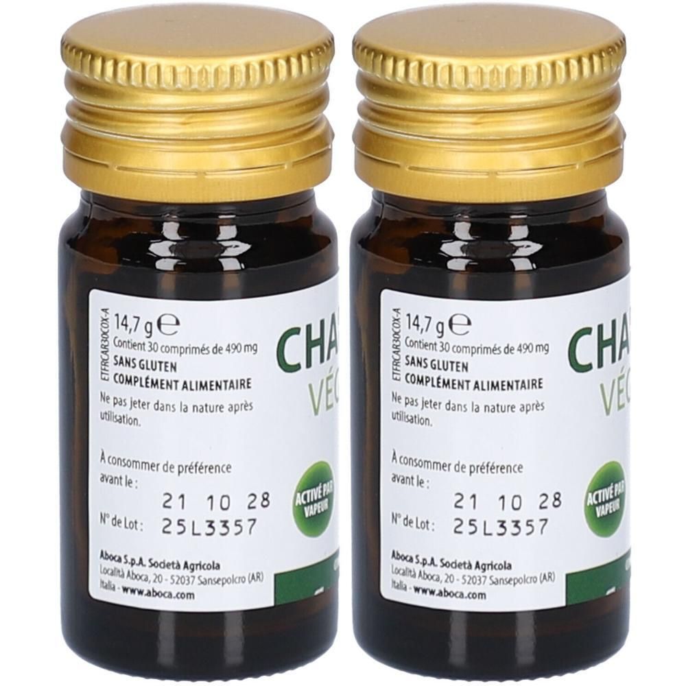 Deux flacons en verre brun avec des couvercles dorés. L'étiquette indique "CHA VE".