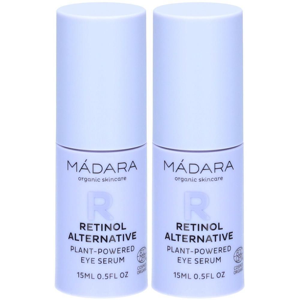 Deux flacons de sérum pour les yeux MADARA Retinol Alternative. Bouchon blanc, flacon violet. Inscription : Retinol Alternative, 15ml 0.5FL OZ.