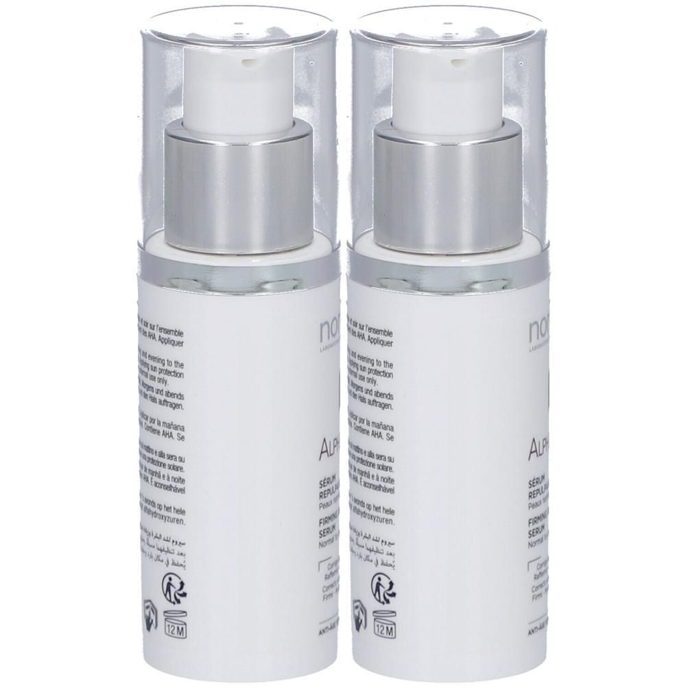 Deux flacons blancs avec pompes argentées et capuchons transparents. Inscription: ALPHA KM+ SÉRUM REPULPANT FERMETÉ.
