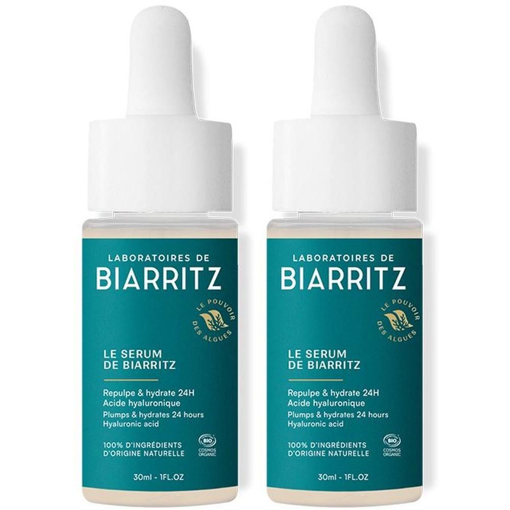 Deux flacons avec pipette. Inscription: LABORATOIRES DE BIARRITZ, LE SERUM DE BIARRITZ. Texte: Repulpe & hydrate 24H, Acide hyaluronique, 100% d'ingrédients d'origine naturelle.