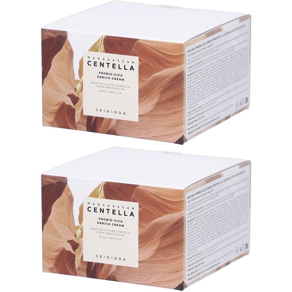 Deux boîtes carrées. Sur le devant, "MADAGASCAR CENTELLA PROBIO-CICA ENRICH CREAM". L'emballage présente un paysage.