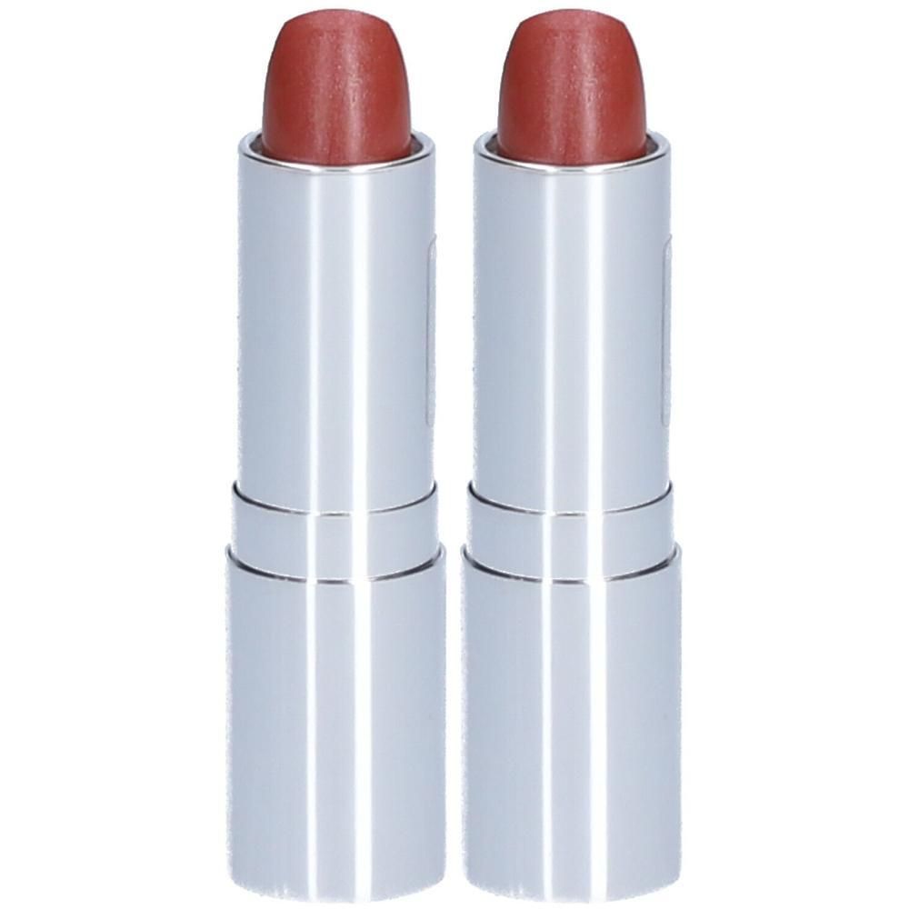 Deux rouges à lèvres rose dans des étuis argentés. Les bâtons sont partiellement sortis.