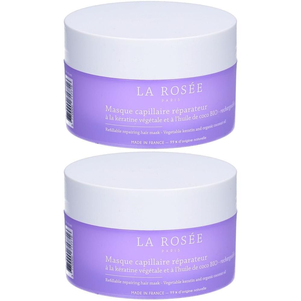 Deux pots ronds avec couvercles blancs et étiquettes violettes. Inscription: LA ROSÉE, Masque capillaire réparateur. Fabriqué en France.