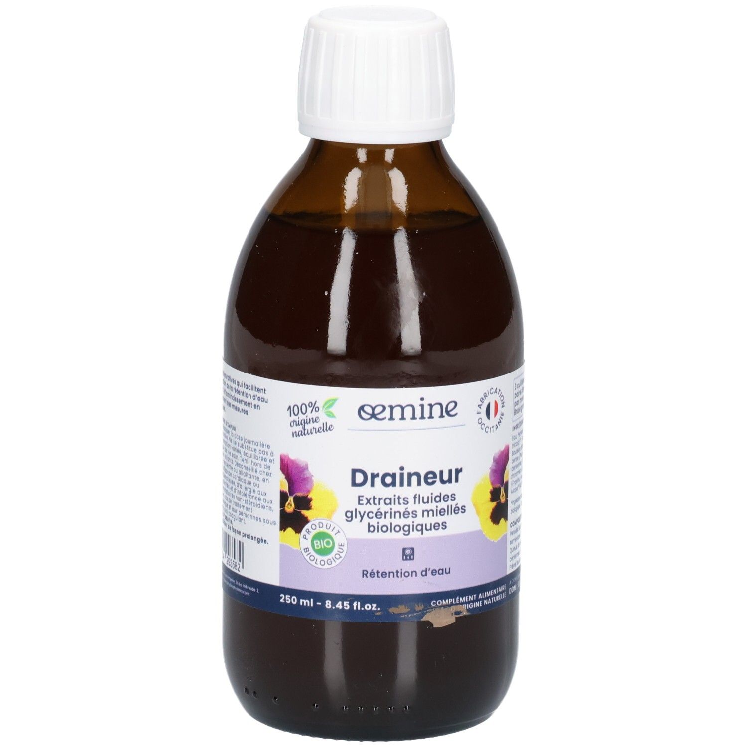 Bouteille en verre brun avec bouchon blanc, étiquette "DRAINEUR" et fleurs.