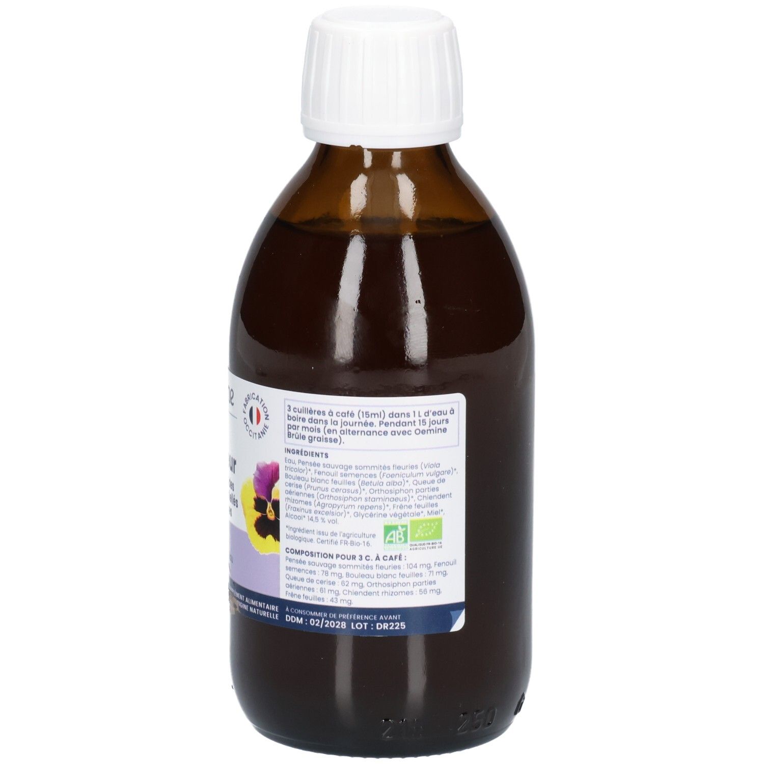 Arrière d'une bouteille en verre brun avec étiquette détaillant les ingrédients et la composition.