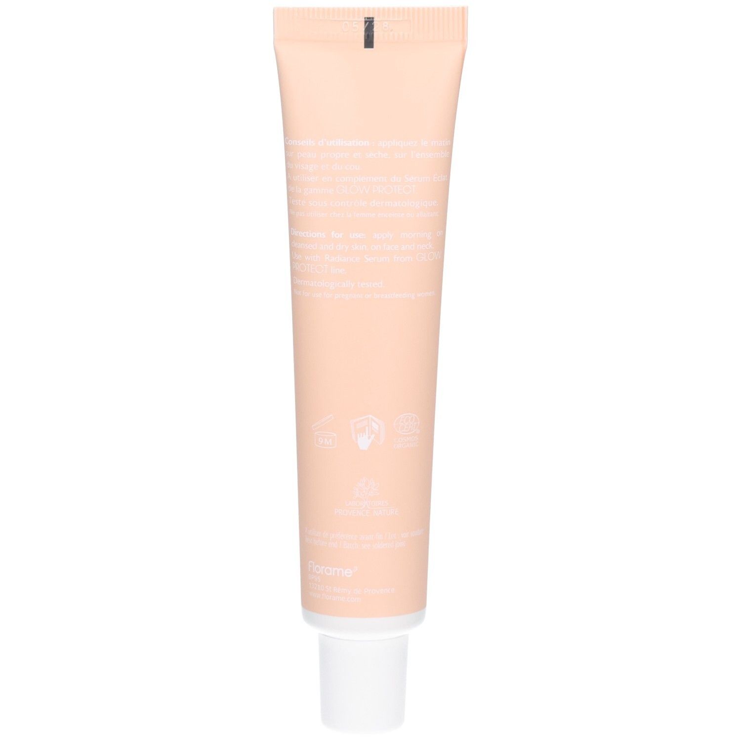 Dos du tube de crème. Texte en blanc sur fond beige. Logos et certifications.
