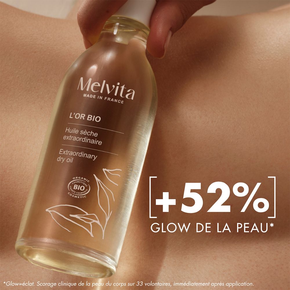 Huile Sèche Extraordinaire L'Or Bio Melvita sur la peau avec amélioration de l'éclat.