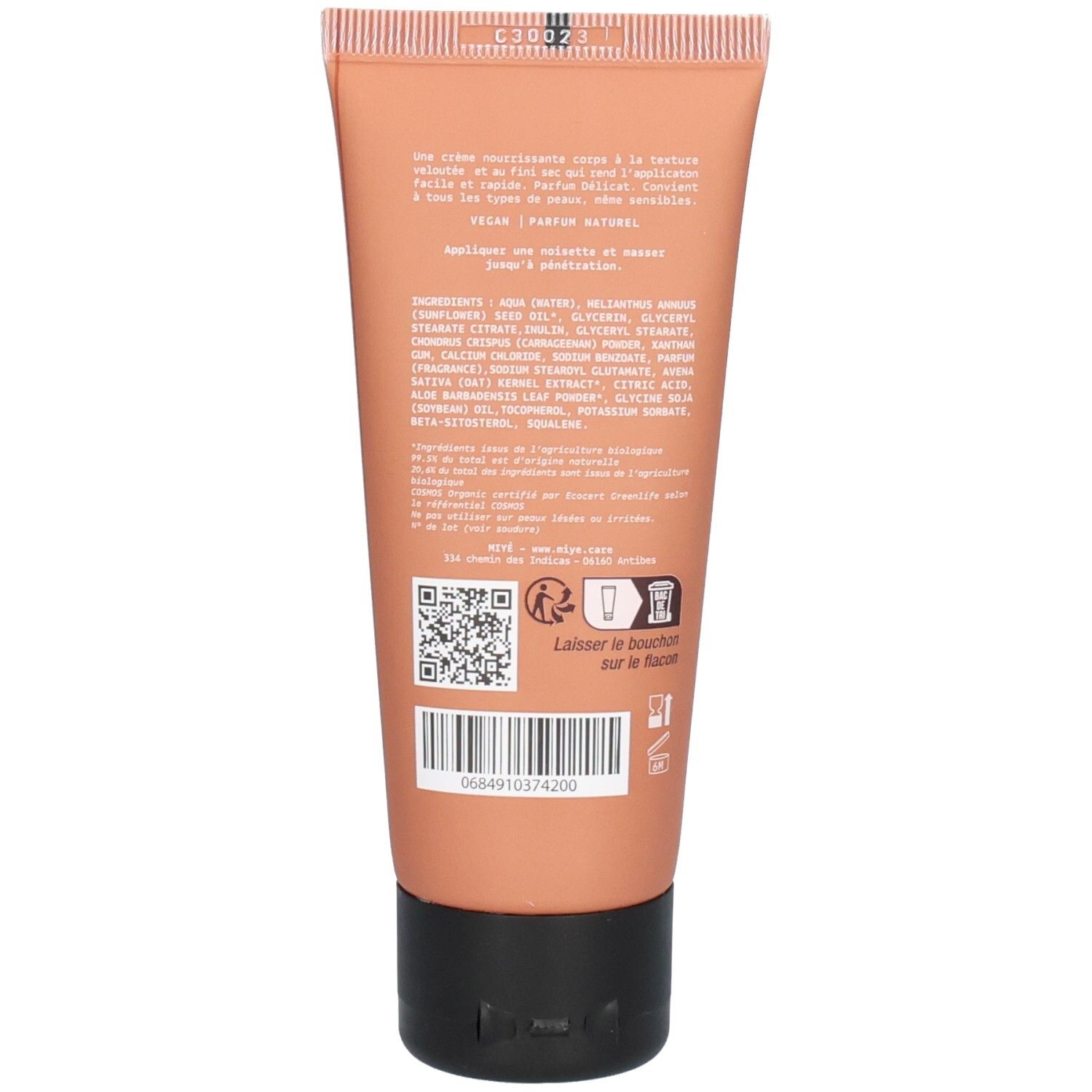 Arrière d'un tube de crème pour le corps, avec liste d'ingrédients et instructions.
