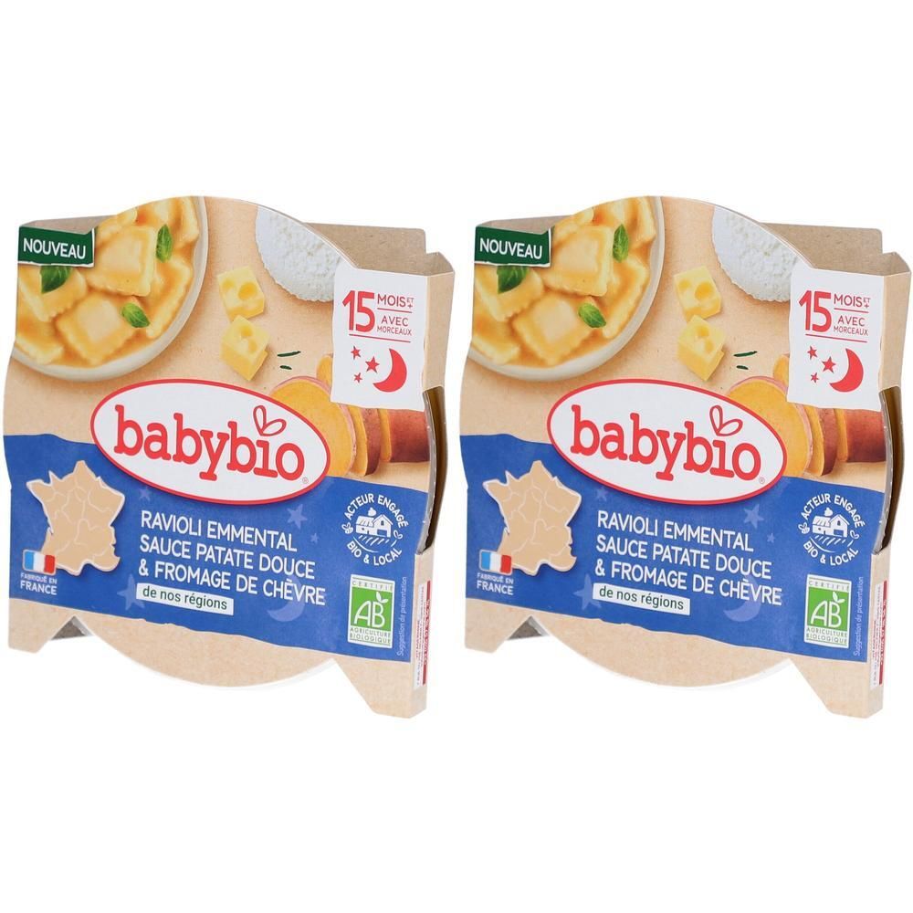 Deux emballages de raviolis Babybio. Inscription: Ravioli Emmental Sauce Patate Douce & Fromage de Chèvre. Label bio, mention "15 mois avec".