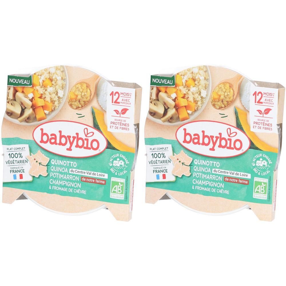 Deux emballages Babybio Quinotto. Inscription: Quinotto, Quinoa, Potimarron, Champignon & Fromage de Chèvre. 100% végétarien. Label AB.