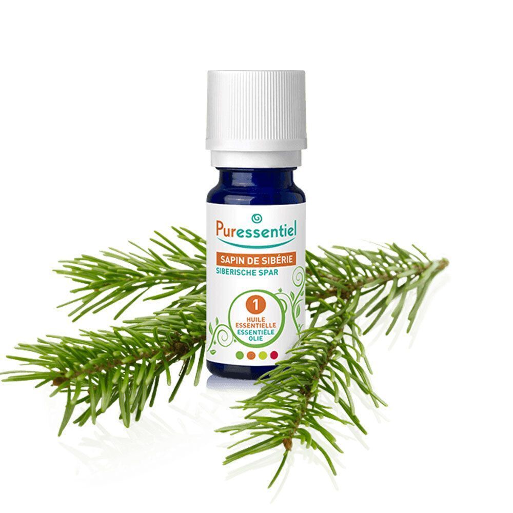 Flacon PURESSENTIEL, verre bleu, bouchon blanc, avec branche de pin. Inscription: Sapin de Sibérie, Huile Essentielle.