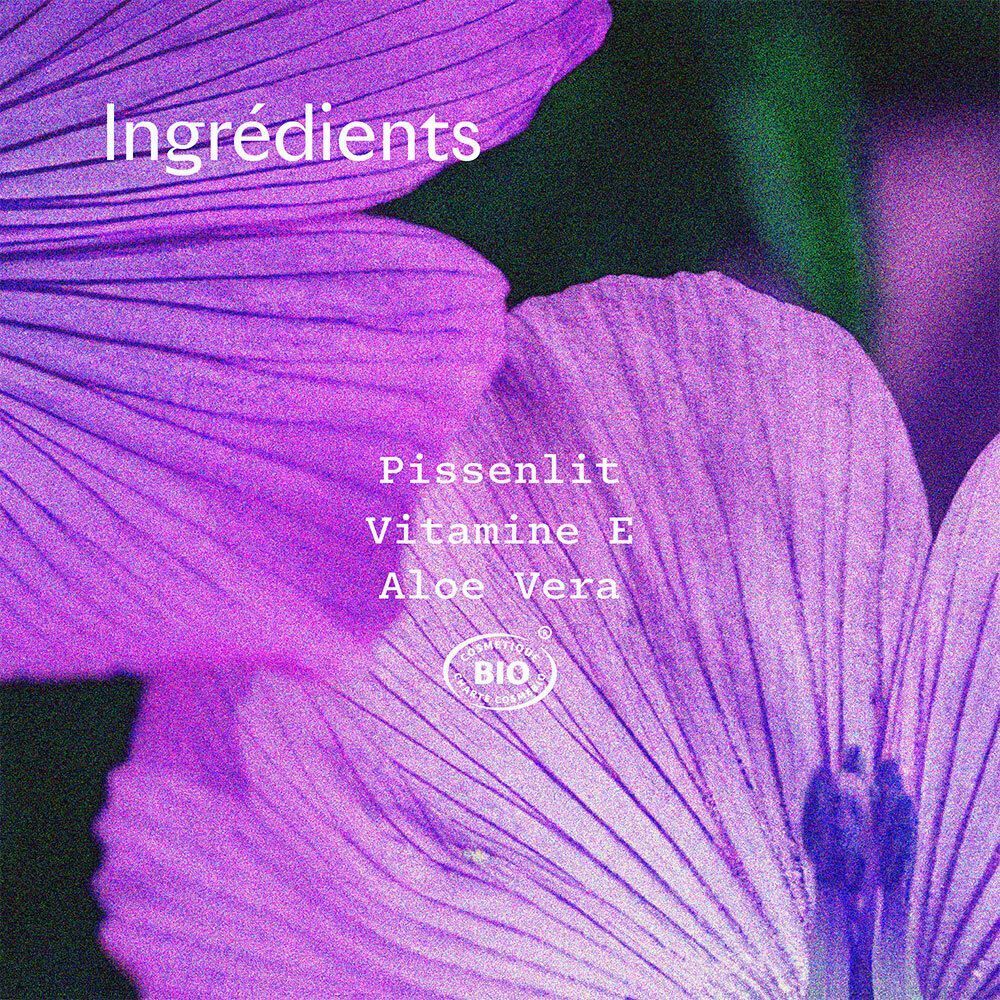 Gros plan de fleurs violettes. Texte: Ingrédients: Pissenlit, Vitamine E, Aloe Vera. Label bio.