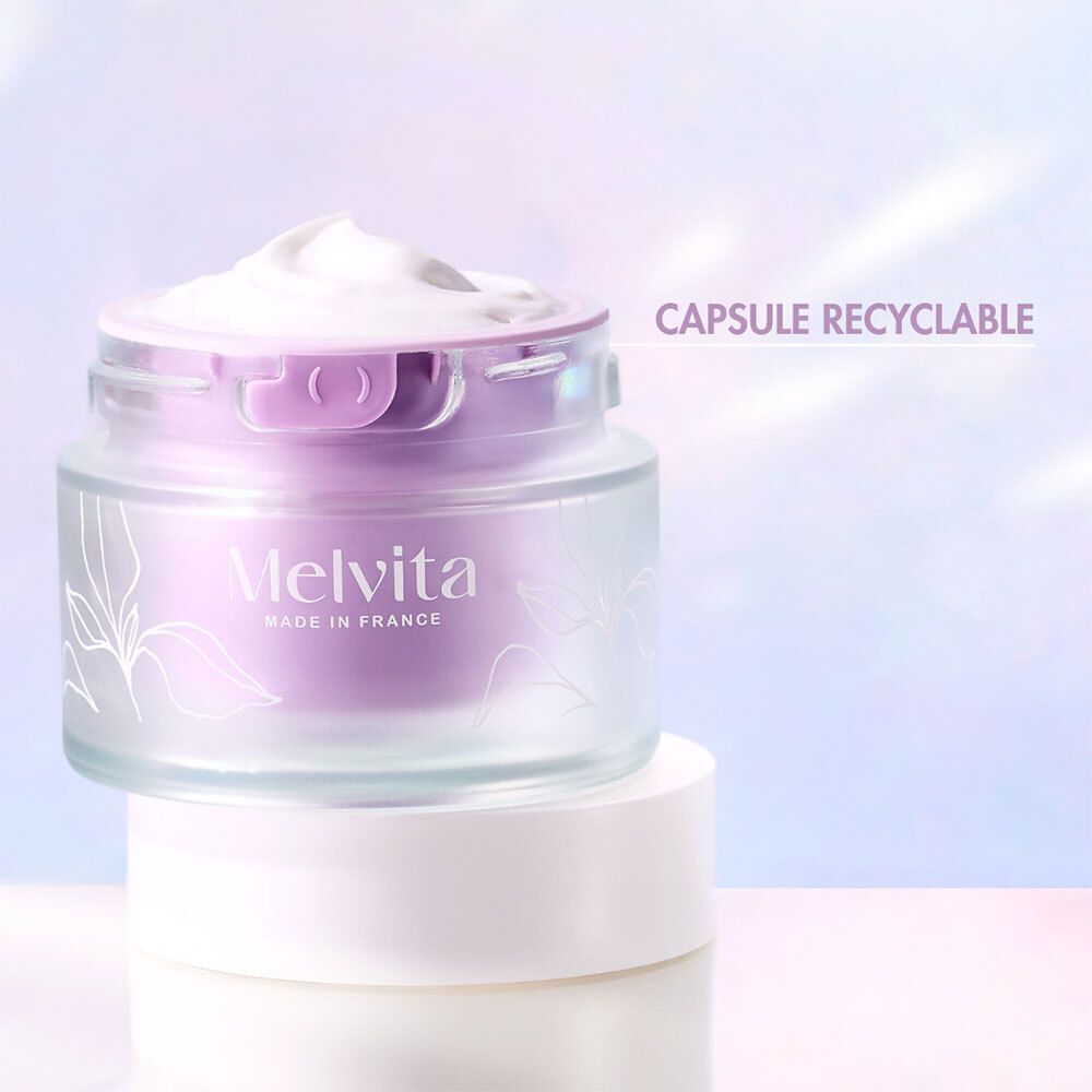 Pot de crème Melvita, motif floral. Texte: Capsule recyclable.