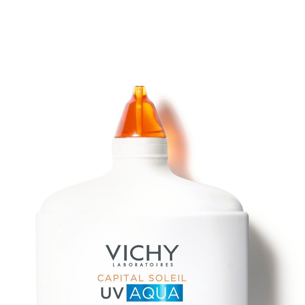 Flacon Vichy Capital Soleil. Blanc avec bouchon orange et embout spray.