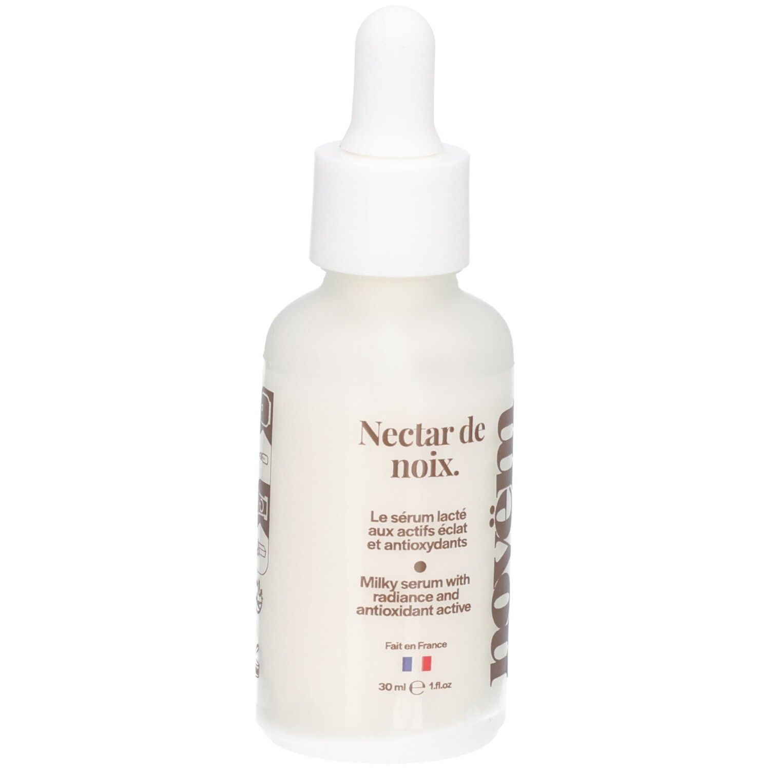 Flacon blanc avec pipette. Inscription : Nectar de noix. Milky serum with radiance and antioxidant active. Marque : novëm.