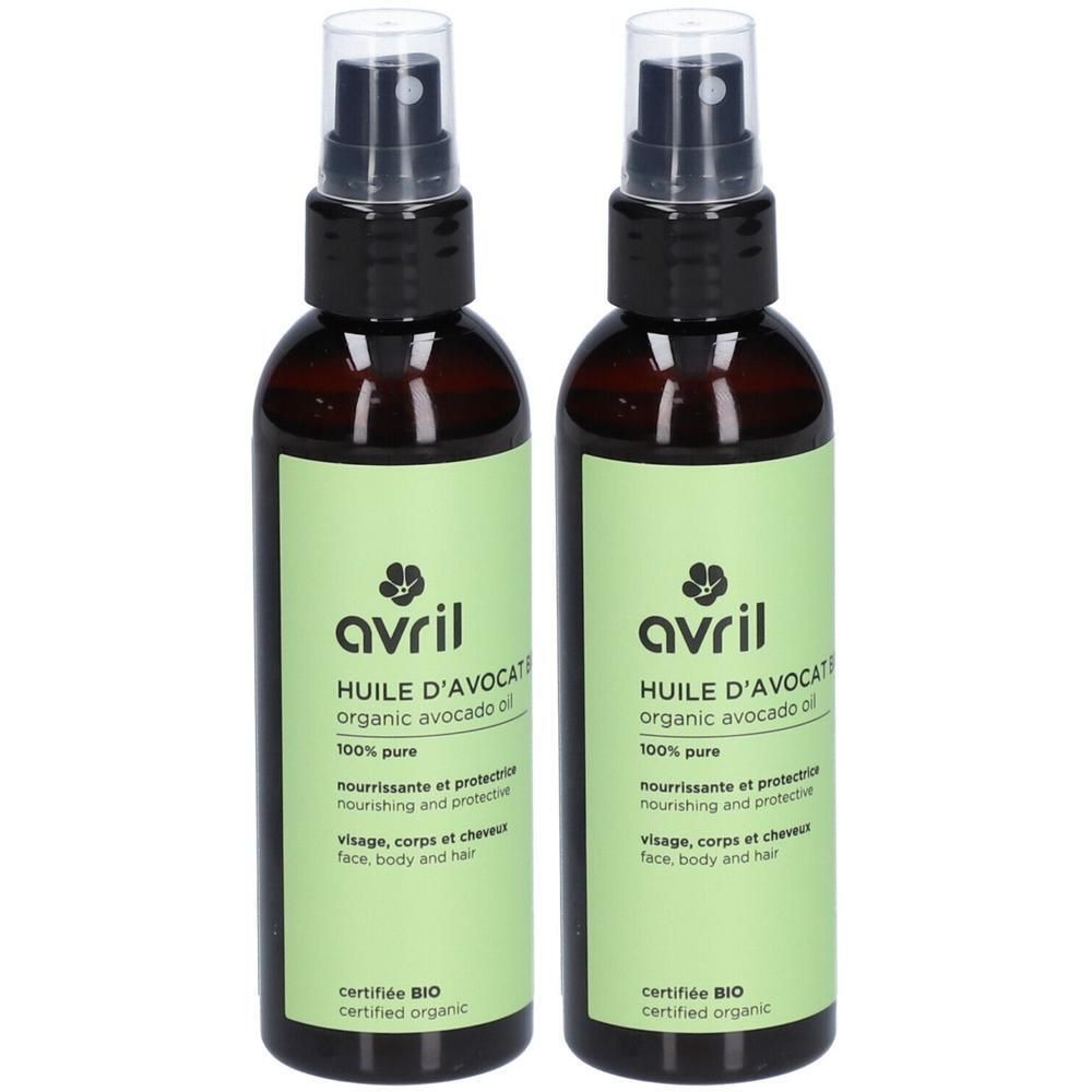 Deux flacons bruns avec vaporisateur et étiquettes vertes. Les étiquettes indiquent "avril", "HUILE D'AVOCAT" et "BIO".