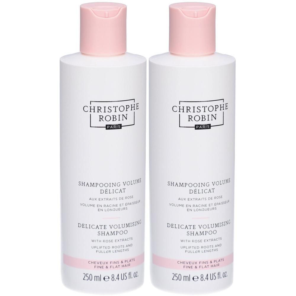 Deux flacons blancs avec bouchons roses. Inscription: Christophe Robin, Shampooing Volume Délicat, Delicate Volumising Shampoo. 250 ml.