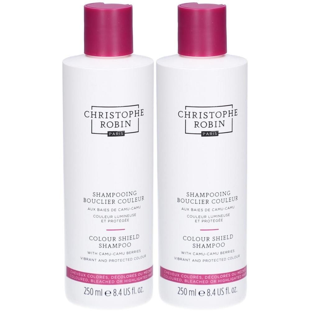 Deux flacons blancs avec bouchons roses. Inscription: CHRISTOPHE ROBIN, SHAMPOOING BOUCLIER COULEUR, COLOUR SHIELD SHAMPOO.