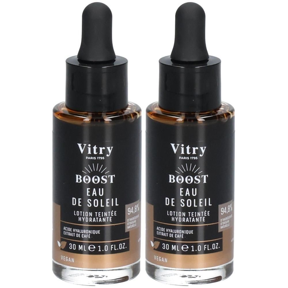 Deux flacons avec bouchon noir et pipette. Inscription: Vitry BOOST EAU DE SOLEIL, Lotion teintée hydratante. 30 ml.