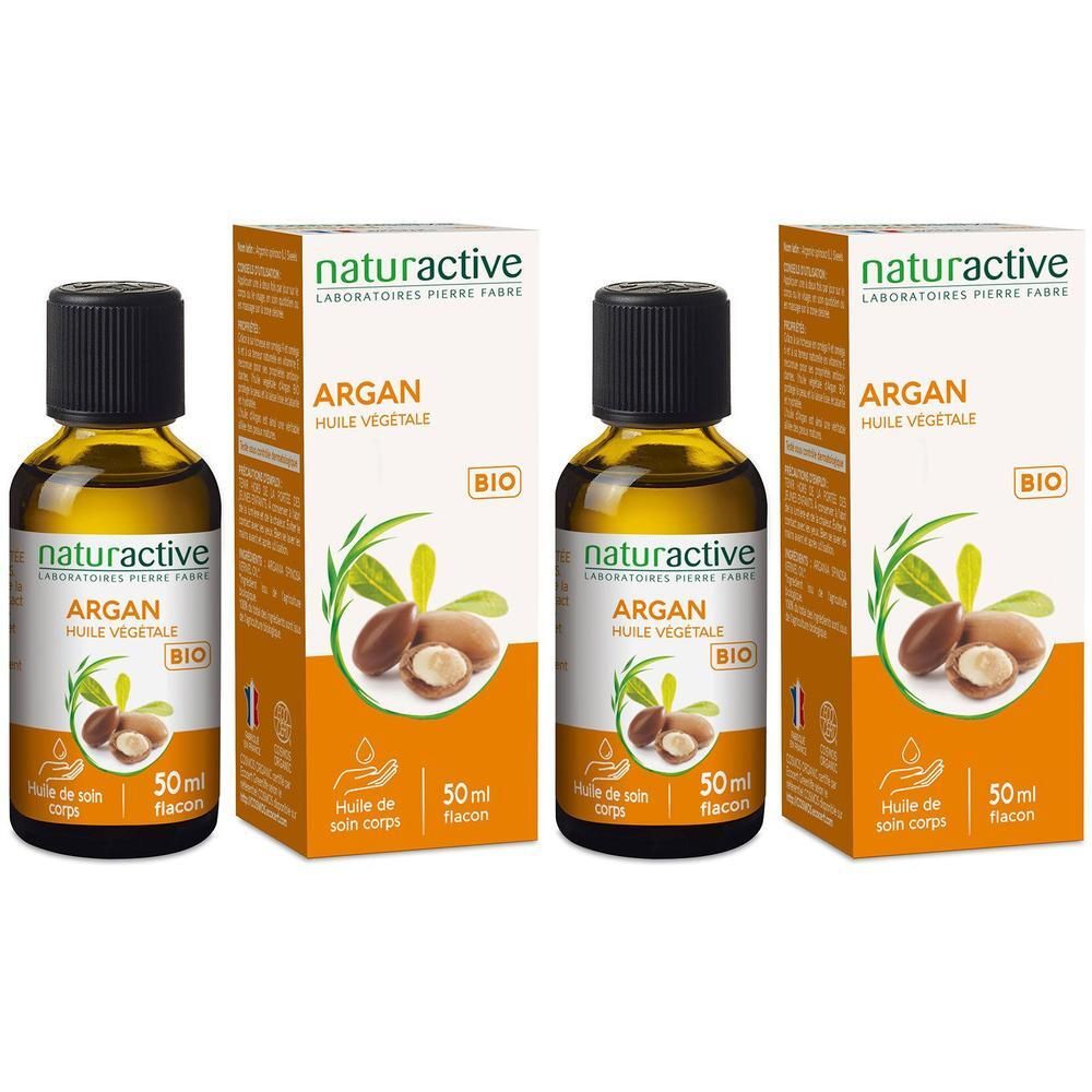 Trois flacons d'huile d'argan avec emballage. Inscription: Argan Huile Végétale Bio. Flacons à bouchon noir, huile jaune.