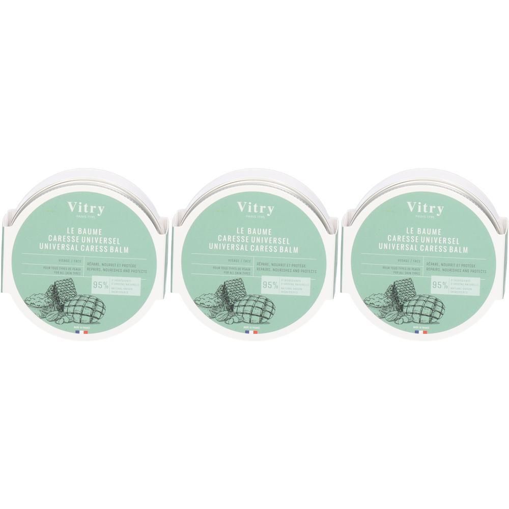 Trois pots ronds avec étiquettes. Les étiquettes indiquent "Vitry LE BAUME CARESSE UNIVERSEL UNIVERSAL CARESS BALM".