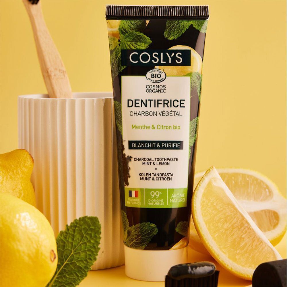 Tube de dentifrice. Inscription: DENTIFRICE CHARBON VÉGÉTAL, Menthe & Citron bio. Certification bio.