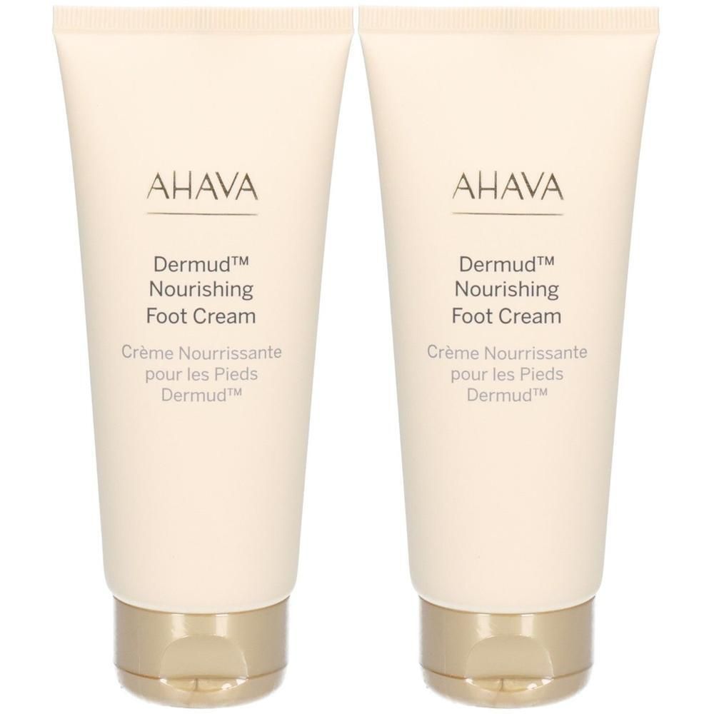 Deux tubes de crème pour les pieds AHAVA Dermud. Tubes beiges avec bouchons dorés. Texte: AHAVA, Dermud, Nourishing Foot Cream.
