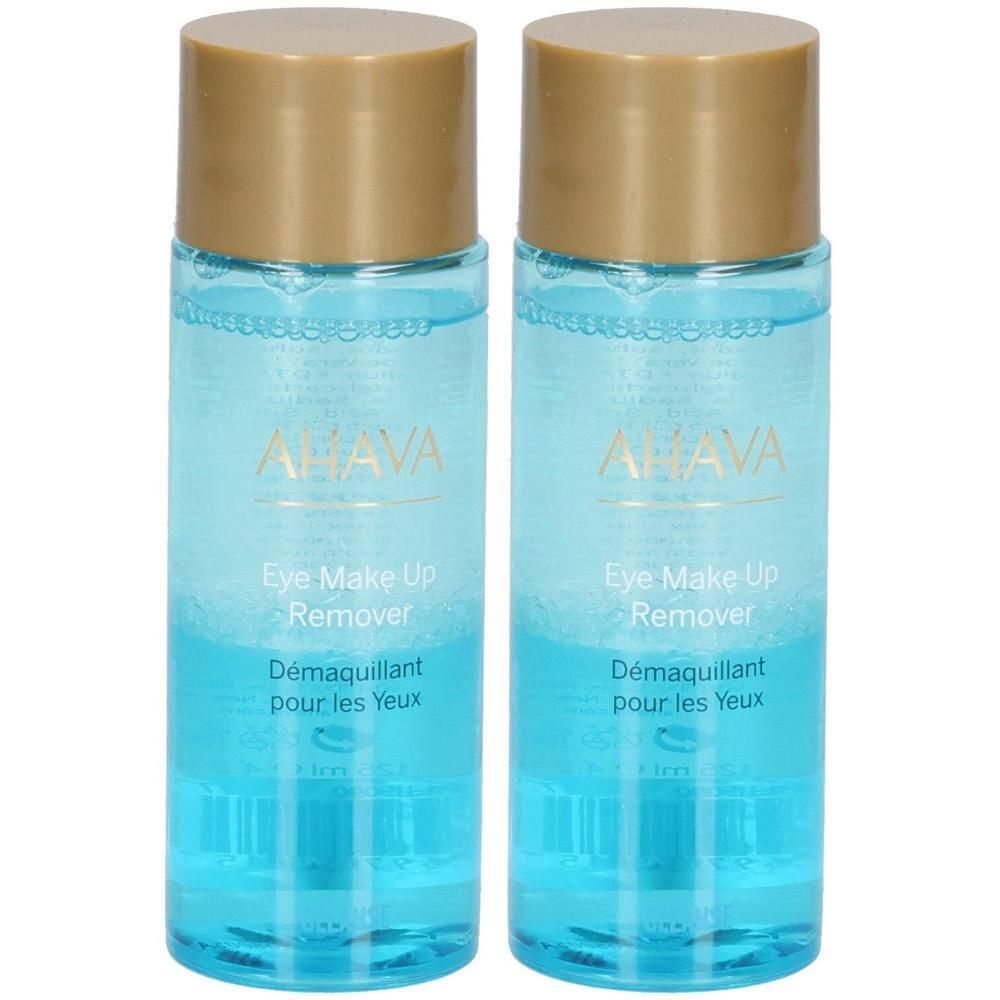Deux flacons avec un liquide bleu et des bouchons dorés. Chaque flacon porte les inscriptions "AHAVA" et "Eye Make Up Remover".