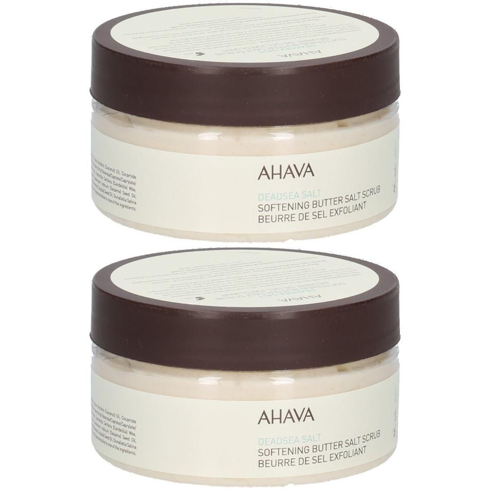 Deux pots de gommage au beurre et sel adoucissant AHAVA Deadsea Salt. Couvercles bruns, étiquette crème avec texte.