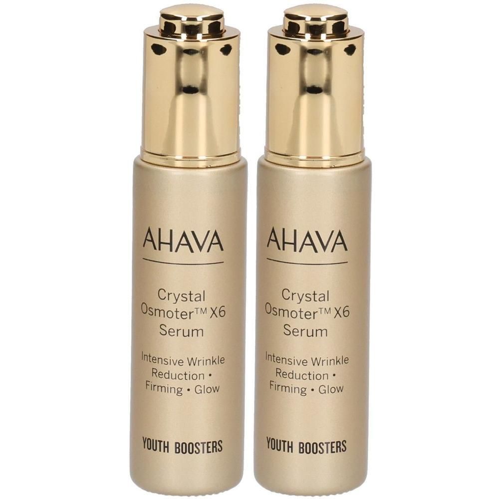Deux flacons dorés avec AHAVA, Crystal Osmoter X6 Serum. Texte: Réduction intensive des rides, raffermissement, éclat. Youth Boosters.