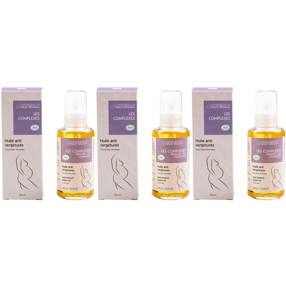 Cinq flacons avec vaporisateur et emballage en carton. Sur les emballages, on lit "LES COMPLEXES" et "HUILE ANTI VERGETURES".