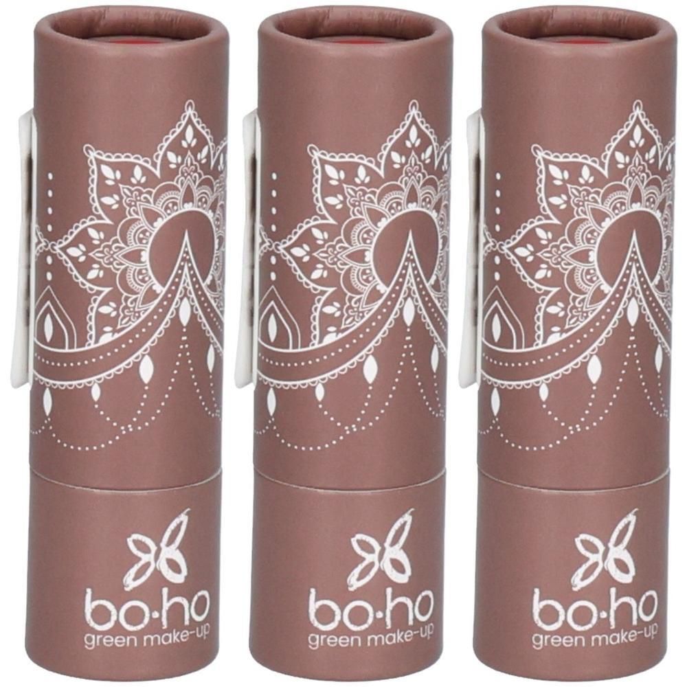 Trois emballages cylindriques avec motif mandala blanc. Inscription: bo.ho green make-up. Emballage en carton brun.