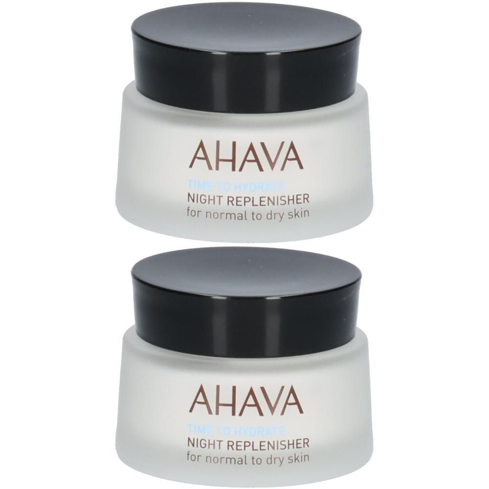 Deux pots de crème de nuit AHAVA. Pots blancs avec couvercles noirs. Inscription : AHAVA, NIGHT REPLENISHER pour peaux normales à sèches.