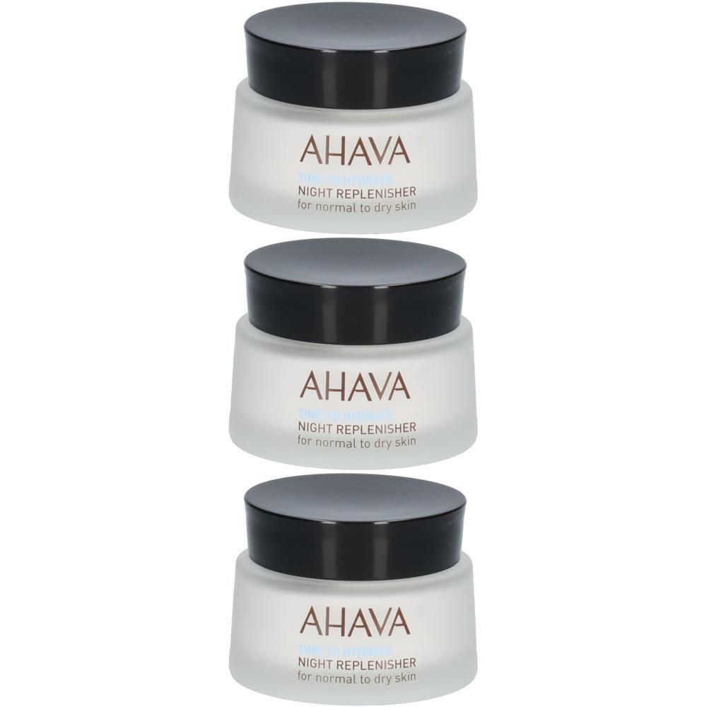 Trois pots AHAVA Night Replenisher. Pots blancs avec couvercles noirs. Inscription AHAVA et nom du produit.
