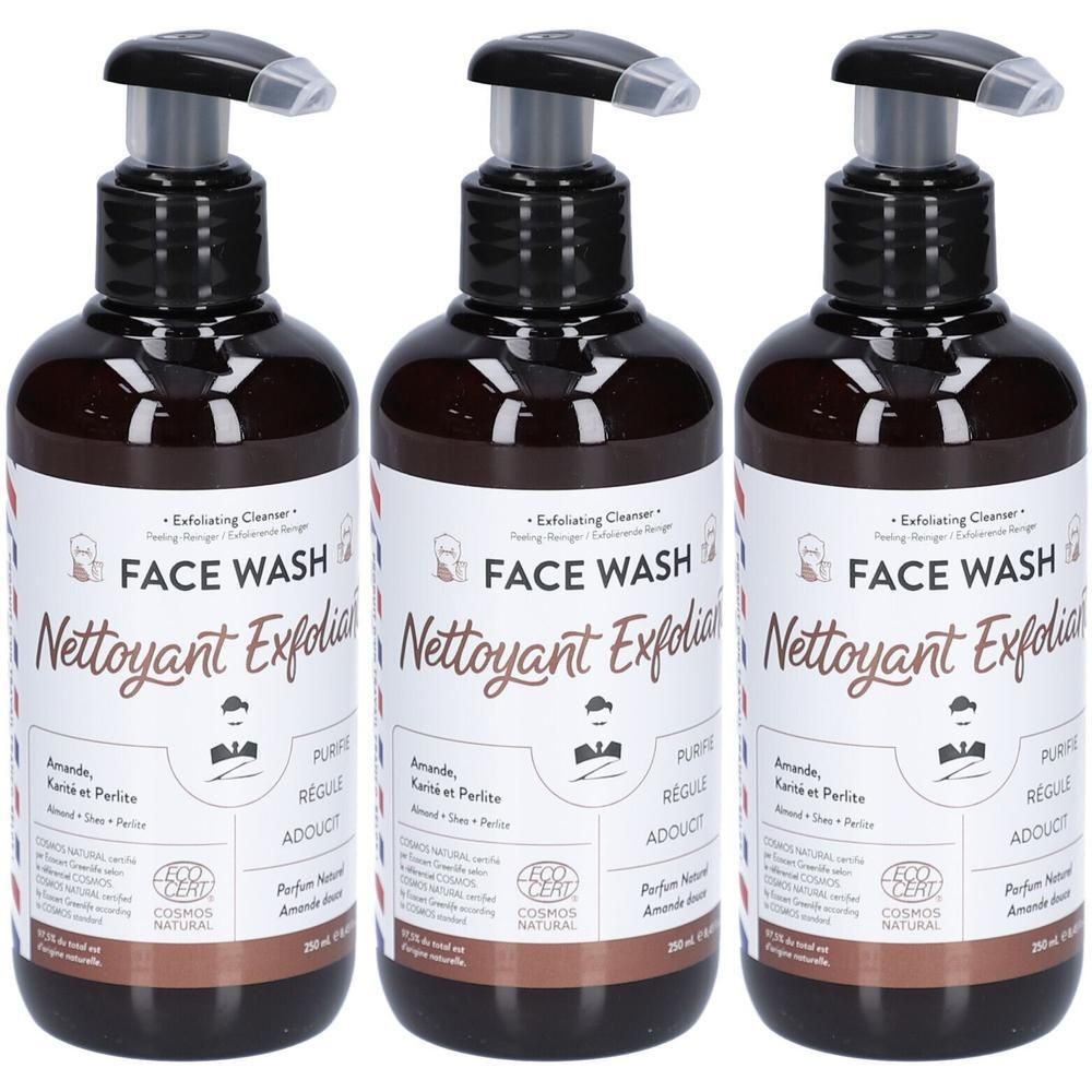 Trois flacons bruns avec pompes noires. Étiquettes : "FACE WASH Nettoyant Exfoliant". Certifié COSMOS NATURAL.