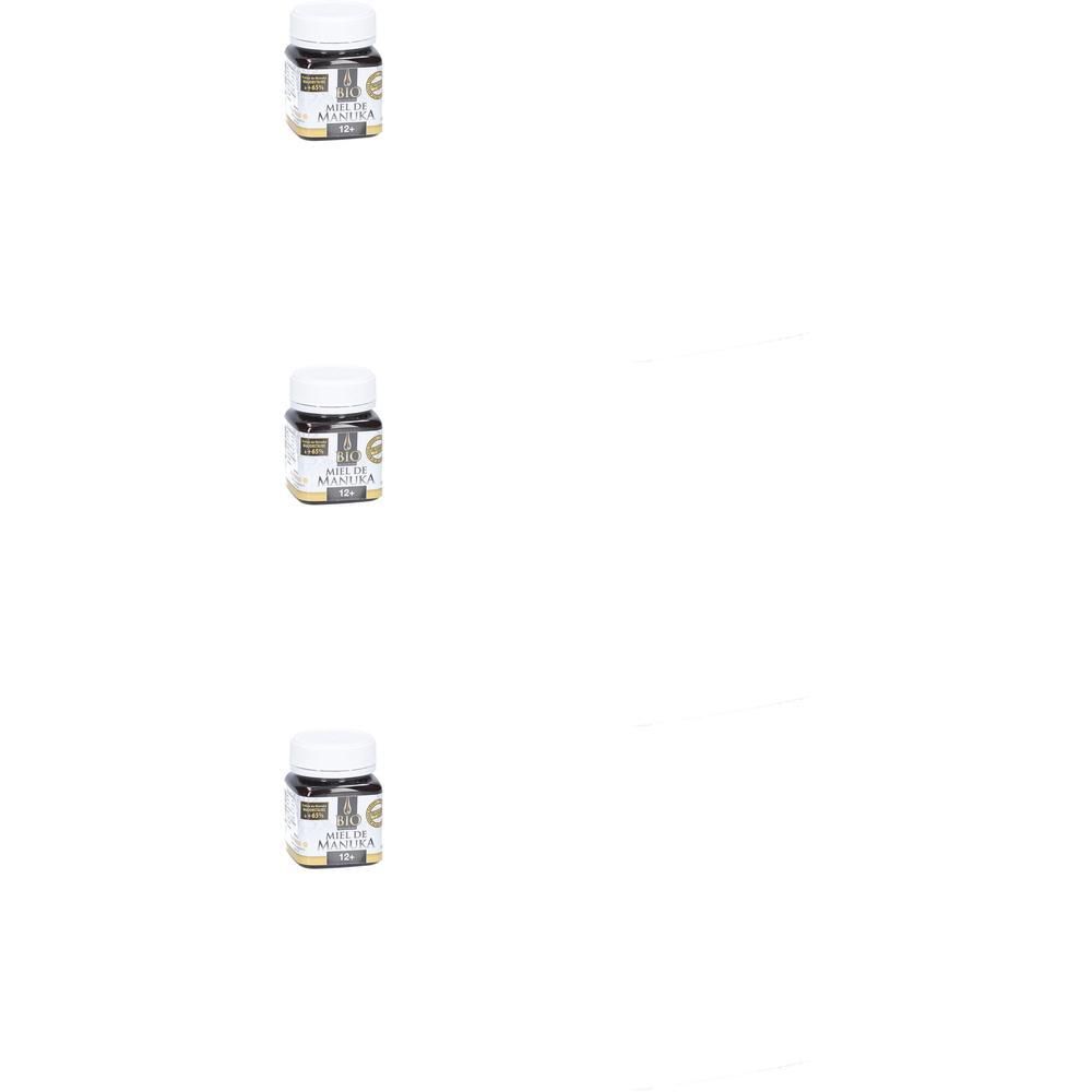Trois pots de miel de Manuka Bio avec couvercle blanc et étiquette.