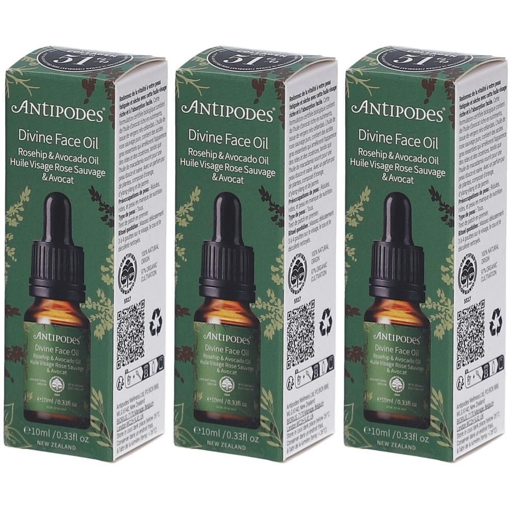 Trois flacons avec compte-gouttes et emballage vert. Inscription: ANTIPODES Divine Face Oil. Contient de l'huile de rose musquée et d'avocat.
