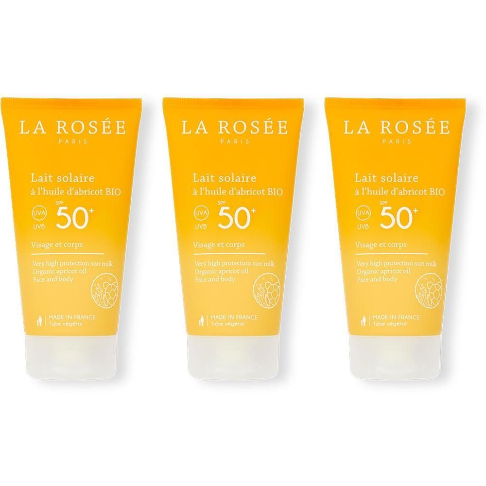 Trois tubes de lait solaire. Emballage jaune avec bouchon blanc. Inscription: LA ROSÉE, Lait solaire SPF50+.