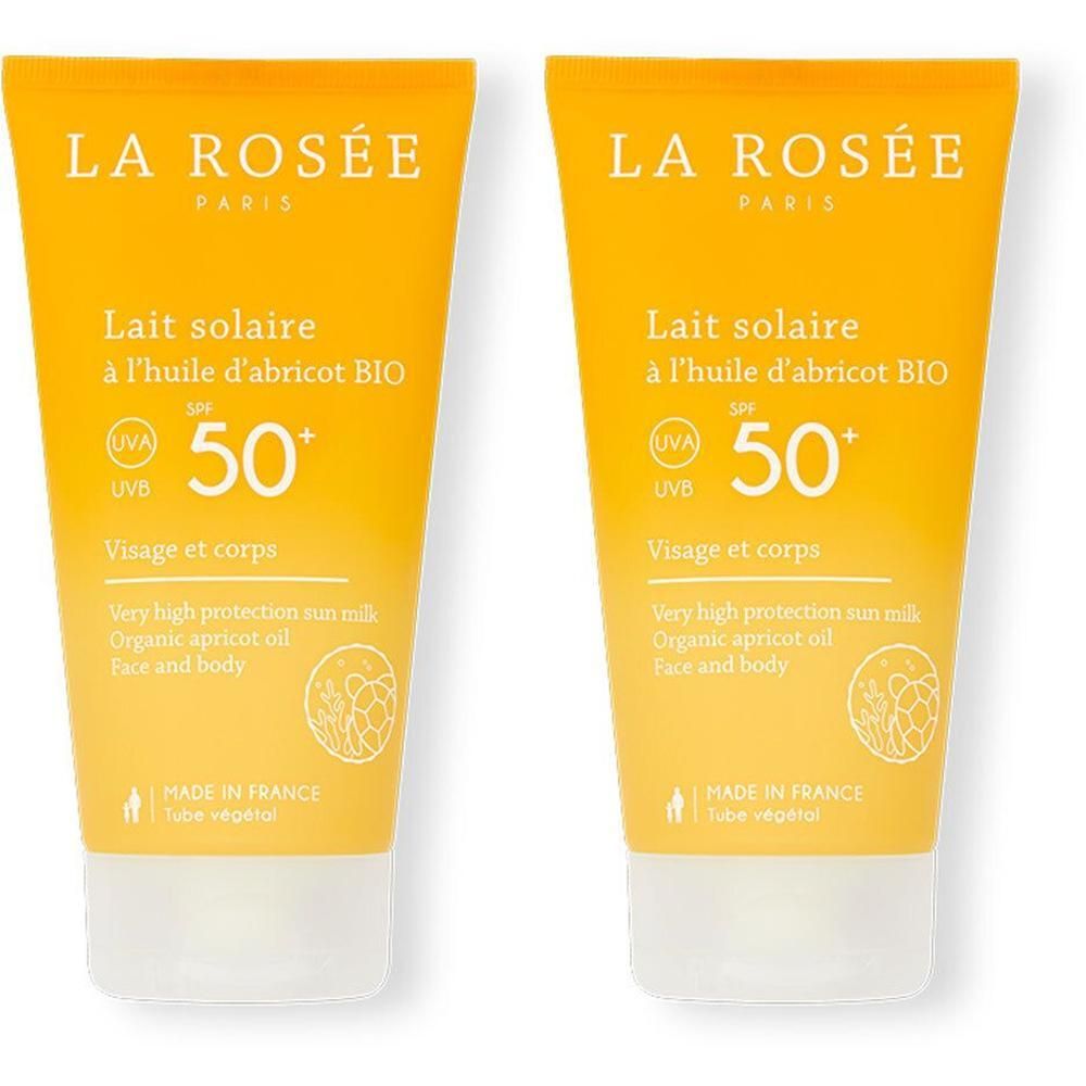 Deux tubes de lait solaire. Inscription: LA ROSÉE, Lait solaire SPF50+, à l'huile d'abricot BIO. Visage et corps. Fabriqué en France.