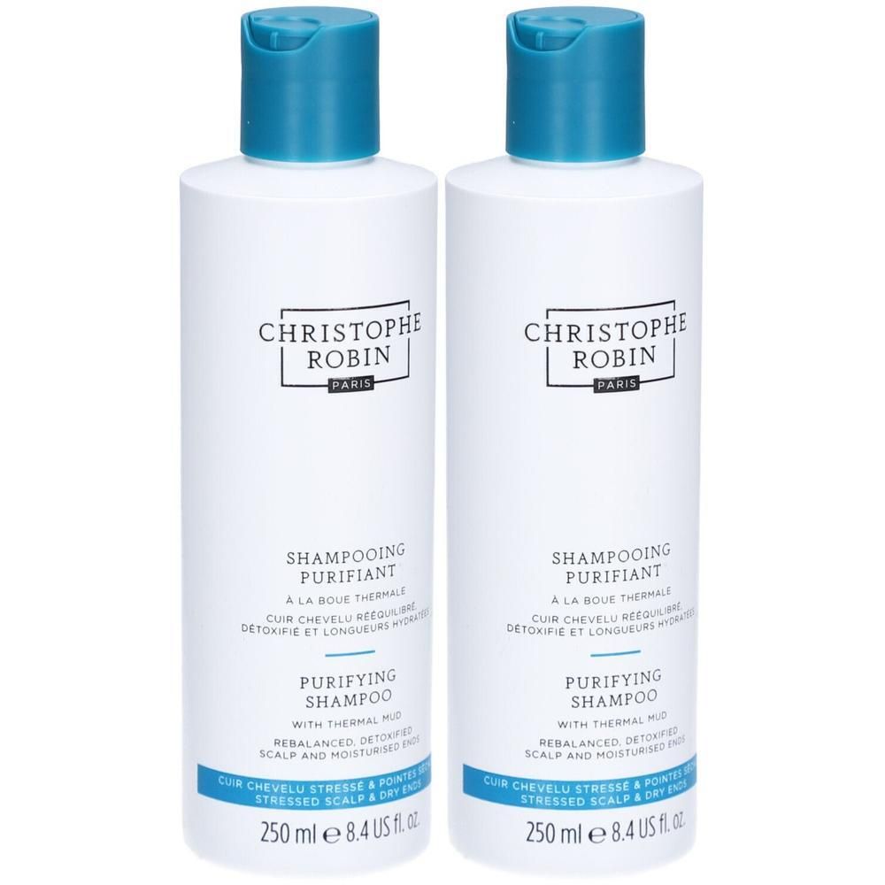 Deux flacons blancs avec bouchons bleus. Inscription : CHRISTOPHE ROBIN PARIS, SHAMPOOING PURIFIANT, PURIFYING SHAMPOO. 250 ml.