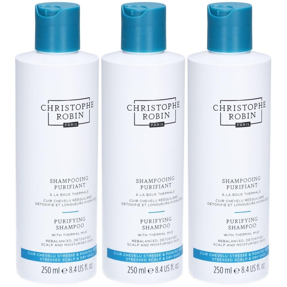 Trois flacons blancs avec bouchon bleu. Inscription: CHRISTOPHE ROBIN, SHAMPOOING PURIFIANT. Texte: Purifying Shampoo, 250 ml.