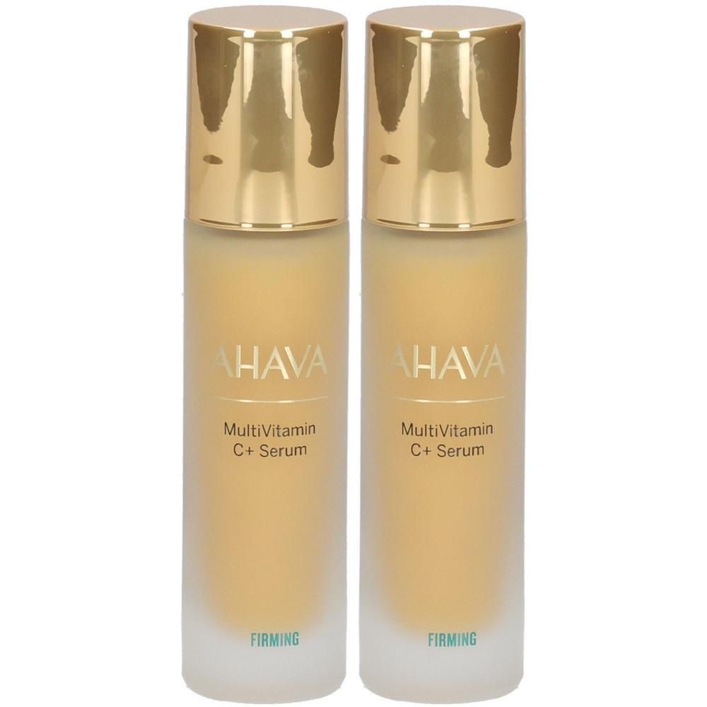 Deux flacons de sérum. Inscription: AHAVA, MultiVitamin C+ Serum, Firming. Bouchon doré, flacon transparent.