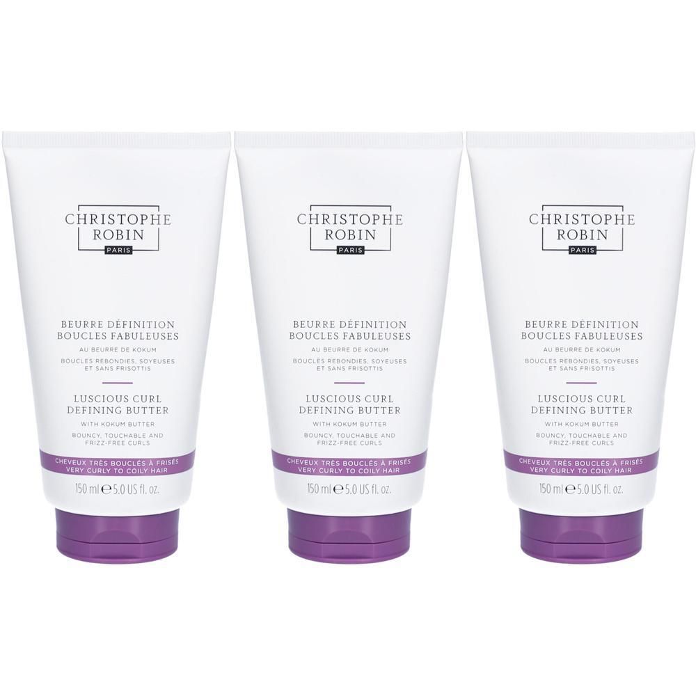 Trois tubes blancs. Chaque tube porte l'inscription "CHRISTOPHE ROBIN" et "BEURRE DEFINITION BOUCLES FABULEUSES". En dessous, "LUSCIOUS CURL DEFINING BUTTER".
