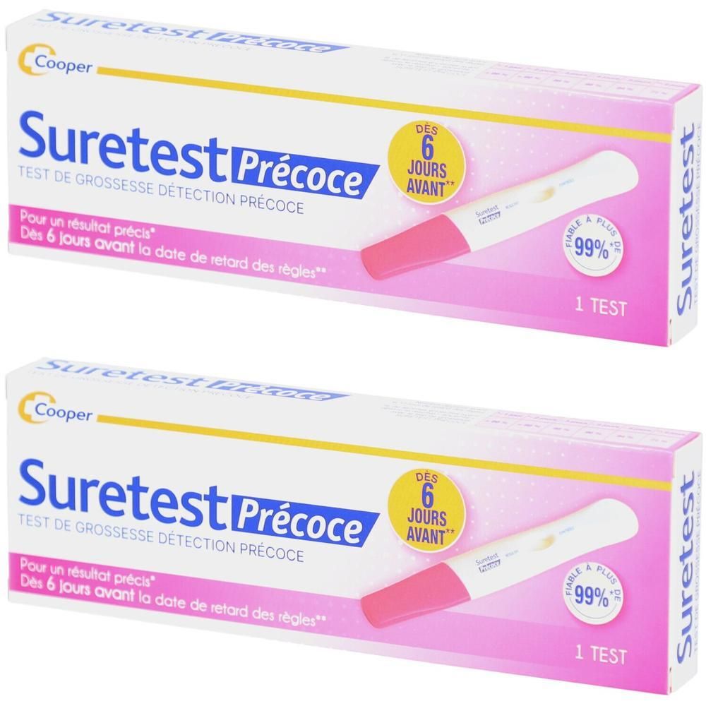 Deux boîtes de test de grossesse Suretest Précoce. Boîte blanche avec accents roses. Test représenté. Texte: 6 jours avant, fiable à 99%.