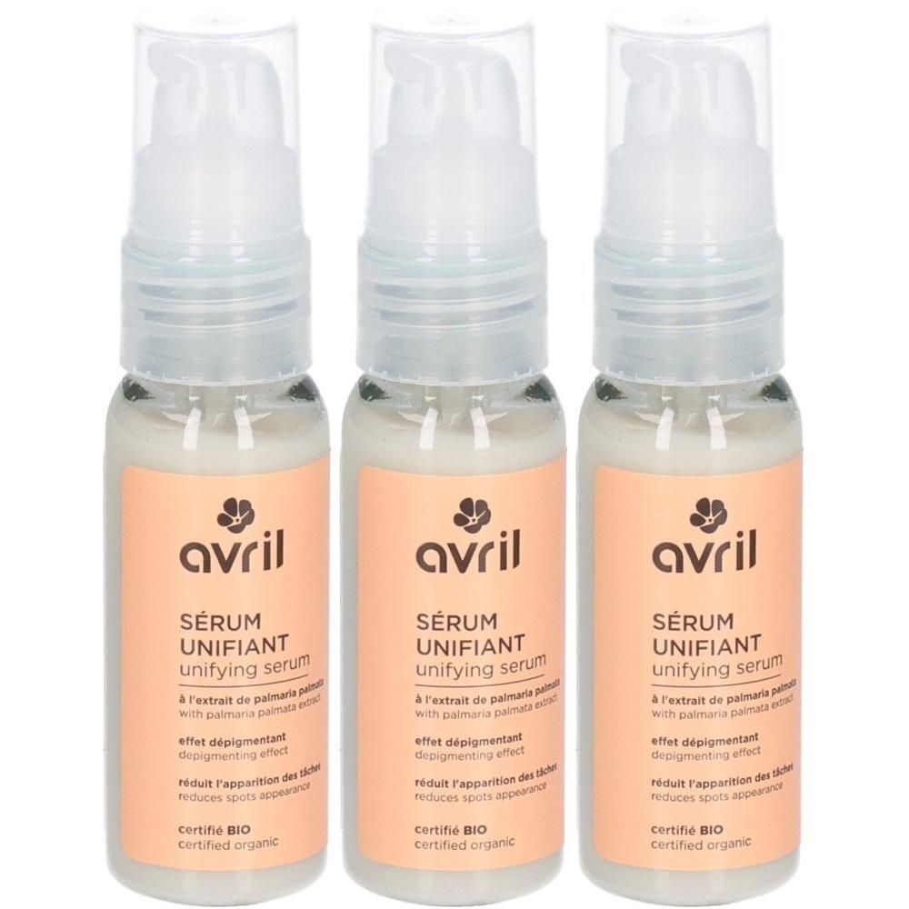Trois flacons de sérum avec pompe. Inscription : avril, SÉRUM UNIFIANT, certifié BIO. Liquide clair dans des flacons en verre avec étiquette orange.