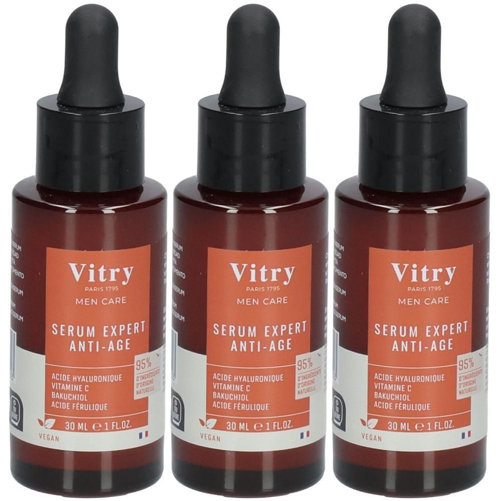 Trois flacons de sérum. Flacons en verre brun avec bouchon noir et pipette. Inscription: Vitry, Serum Expert Anti-Age.