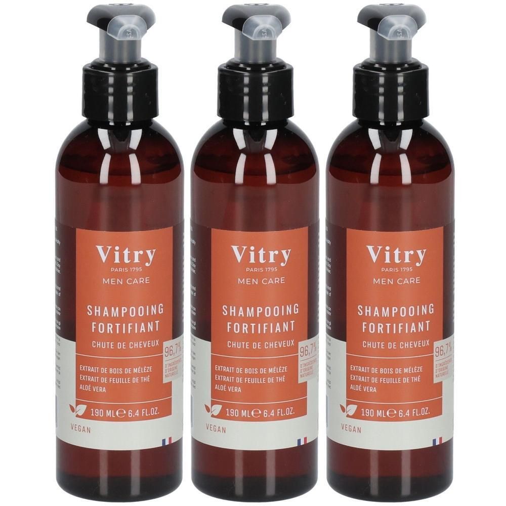 Trois flacons bruns avec pompe noire. Étiquettes avec Vitry, Shampooing Fortifiant. Vegan.