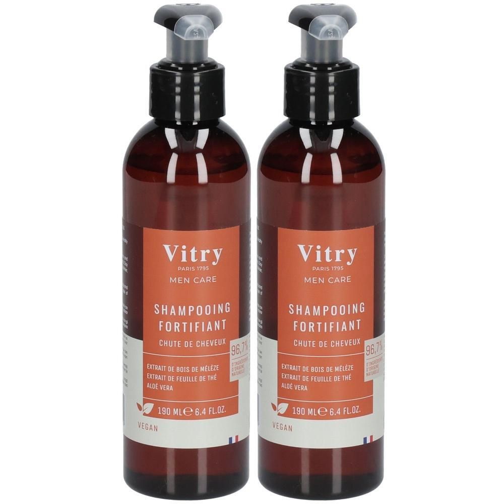 Deux flacons bruns avec pompes noires. Étiquettes: Vitry, Shampooing Fortifiant, vegan. Drapeau français.