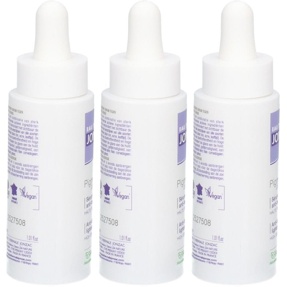 Trois flacons blancs avec compte-gouttes. Chaque flacon porte une étiquette violette avec du texte et le logo "Vegan".