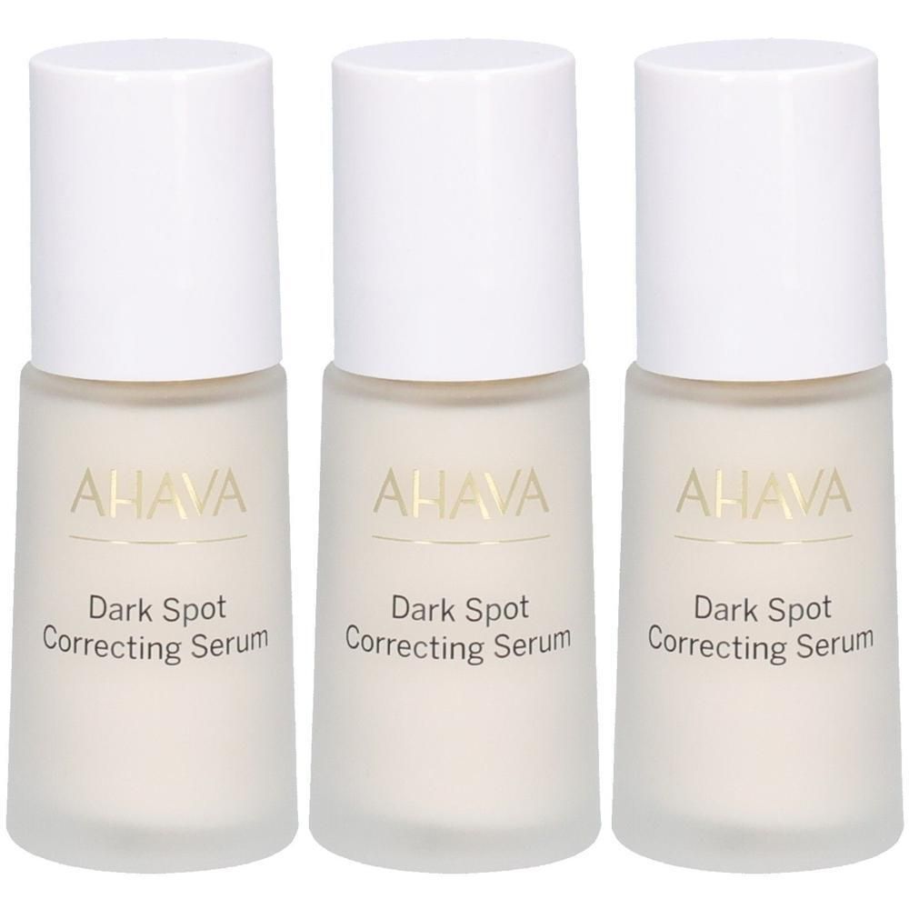 Trois flacons avec bouchons blancs. Le texte AHAVA et Dark Spot Correcting Serum est visible.